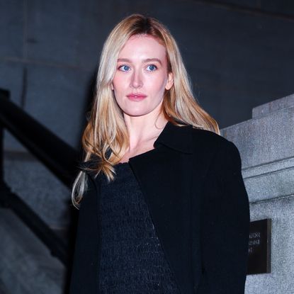 Sarah Pidgeon attends the Khaite fashion show during New York Fashion Week on February 14, 2026 wearing a sleek black outfit seemingly inspired by Carolyn Bessette-Kennedy's timeless '90s minimalism