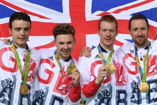 Gold medallists Britain's Owain Doull, Britain's Edward Clancy, Britain's Steven Burke and Britain's Bradley Wiggins pose on the podium after the men's Team Pursuit