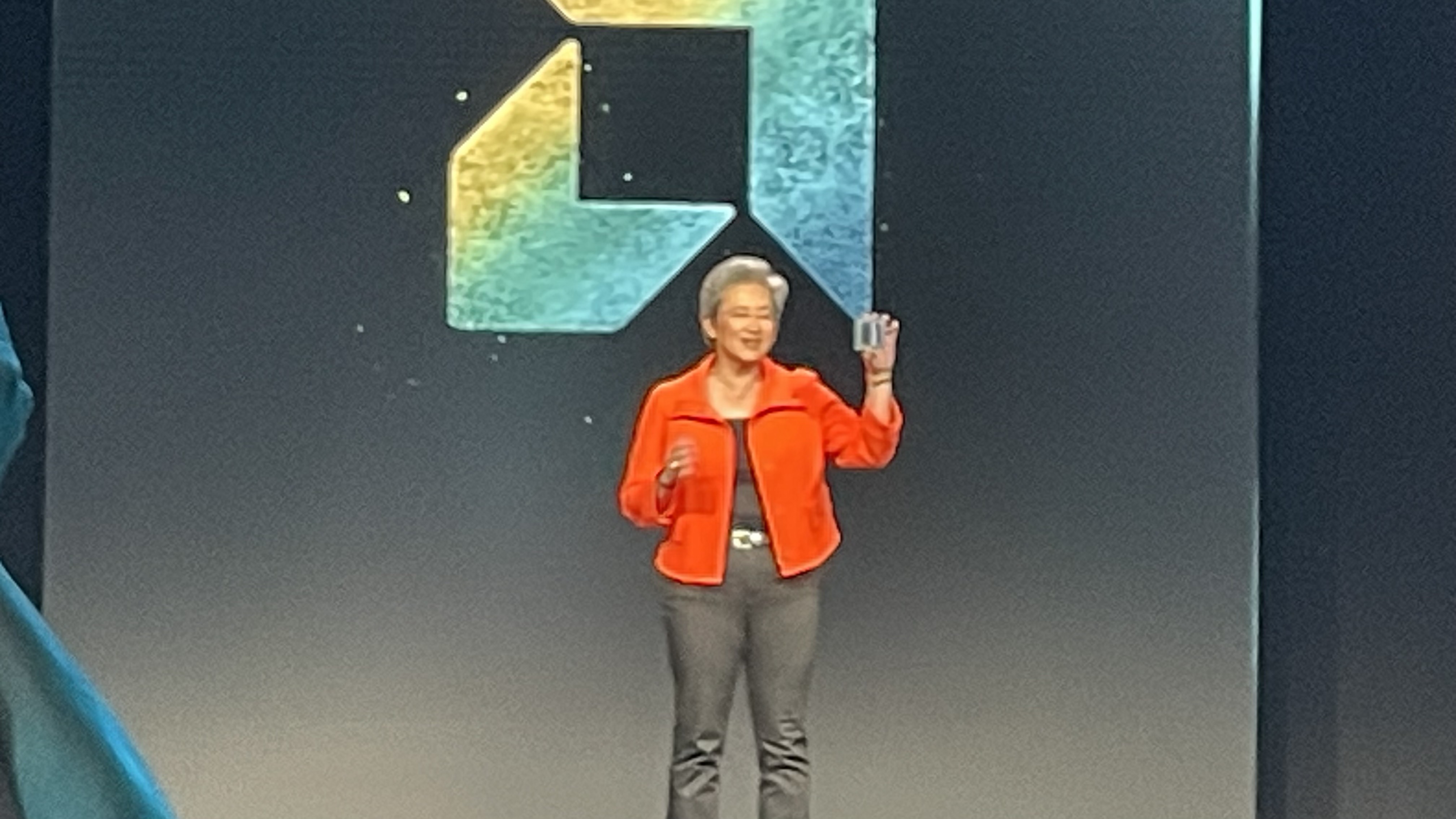 A close up of Lisa Su on stage at AMD Advancing AI 2025 holding the MI350