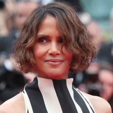 Halle Berry on the Cannes red carpet wearing a striped Jacquemus dress