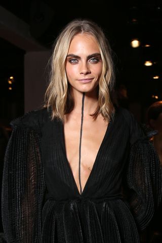 Cara Delvingne black line down chest at Burberry