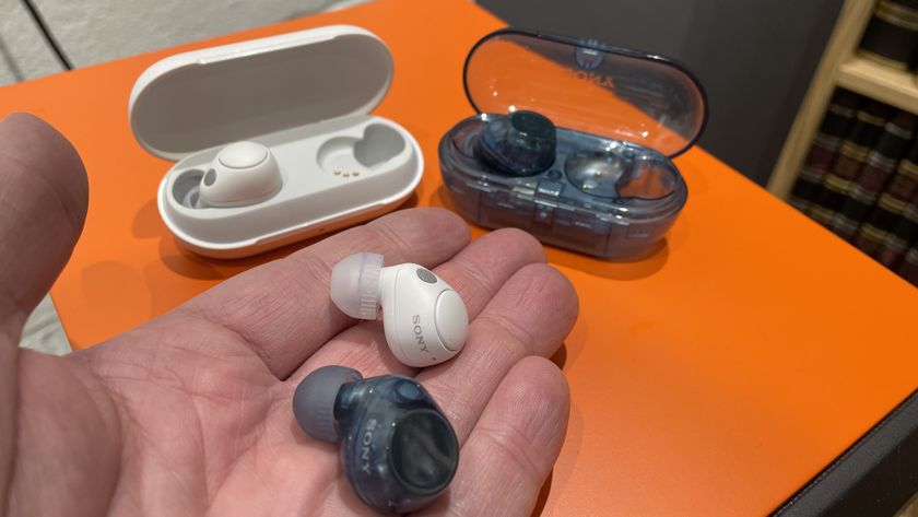 Sony WF-C710N and Sony WF-C700N wireless earbuds being held in the palm of a hand