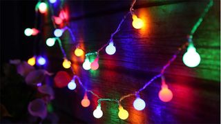 A string of colourful globe lights for Christmas.