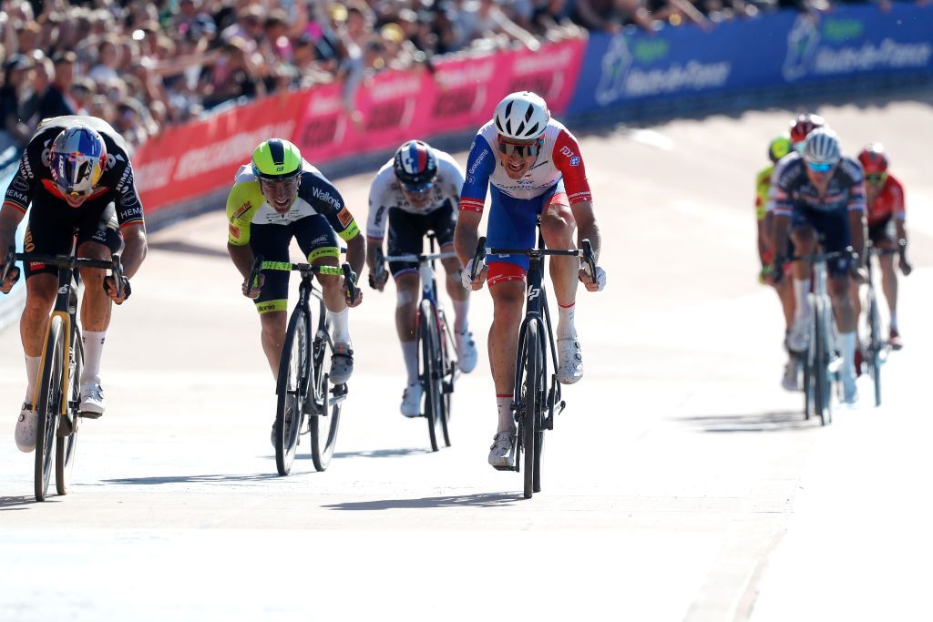 ROUBAIX FRANCE APRIL 17 LR Wout Van Aert of Belgium and Team Jumbo Visma and Stefan Kng of Switzerland and Team Groupama FDJ sprint to win during the 119th ParisRoubaix 2022 Mens Elite a 2572km one day race from Compigne to Roubaix ParisRoubaix WorldTour on April 17 2022 in Roubaix France Photo by Bas CzerwinskiGetty Images