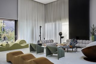 A living room with multicolored sofas