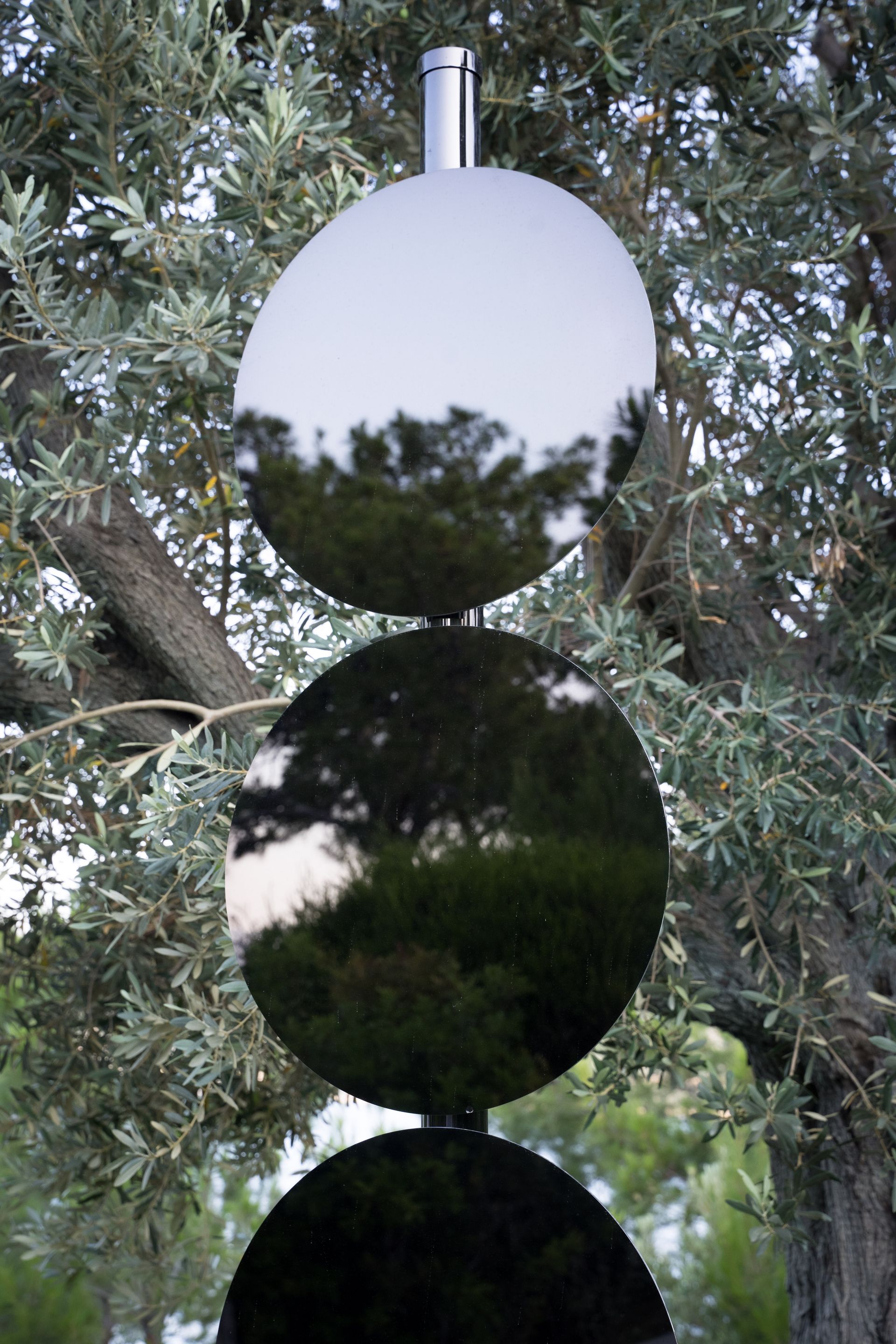 Elmgreen & Dragset black mirrored artwork resembling road sign, installed at Bodrum Loft / Perrotin exhibition