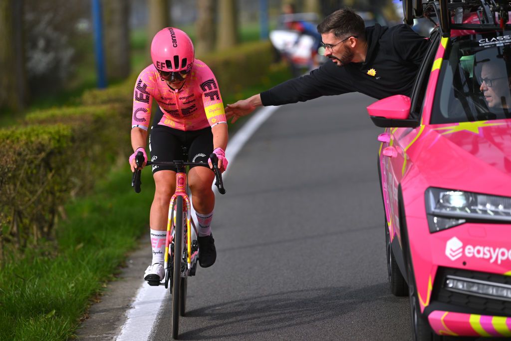 DE PANNE BELGIUM MARCH 21 Lotta Henttala of Filand and Team EF EducationCannondale assisted by the team car due to a shoe problem during the 7th Womens Classic BruggeDe Panne 2024 a 155km one day race from Brugge to De Panne on March 21 2024 in De Panne Belgium Photo by Luc ClaessenGetty Images