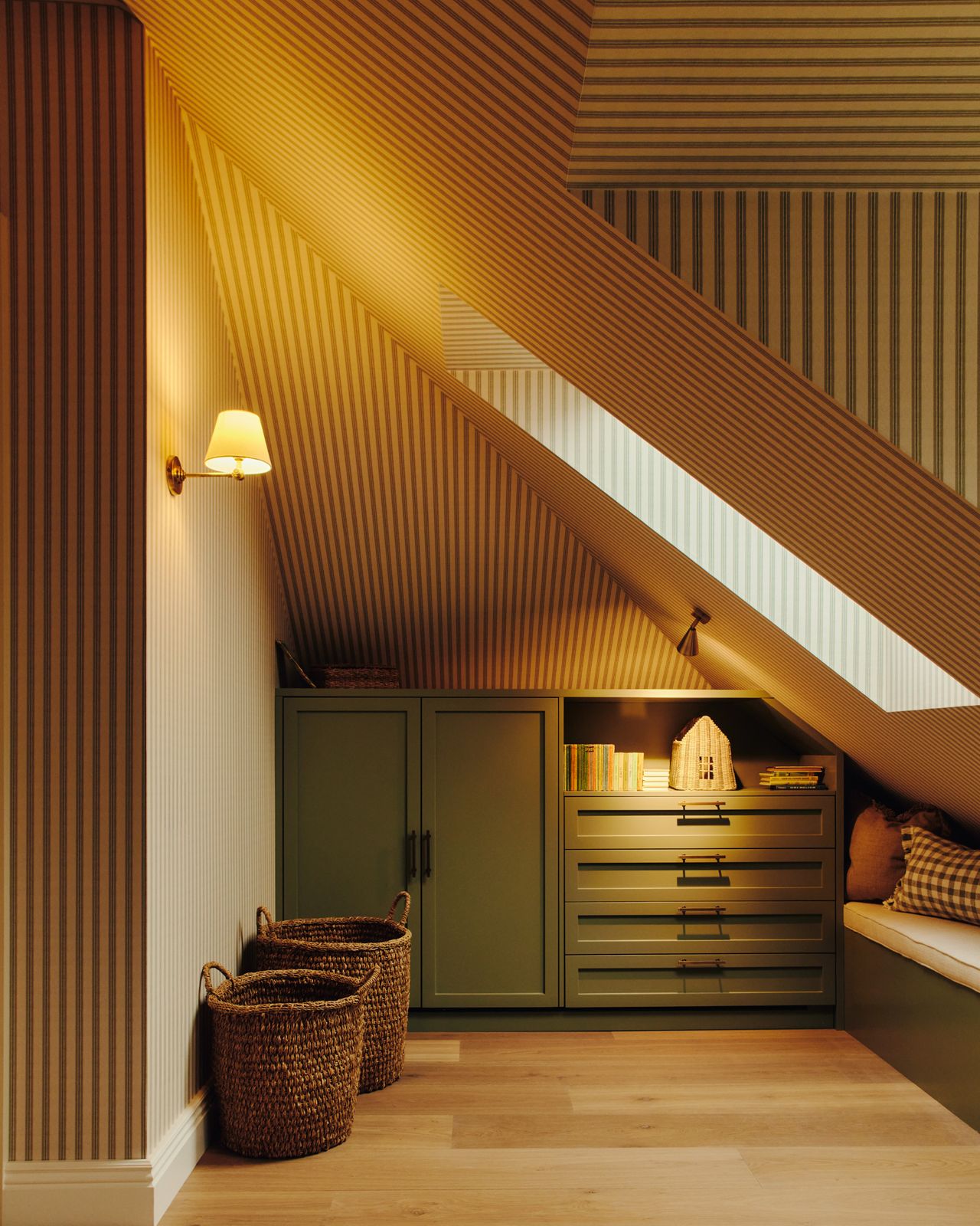 Corner view of attic bedroom with wall lighting