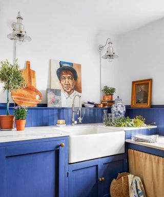 blue kitchen with art