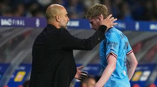 Pep Guardiola consoles Kevin De Bruyne after the midfielder leaves the pitch injured in the Champions League final against Inter in June 2023.