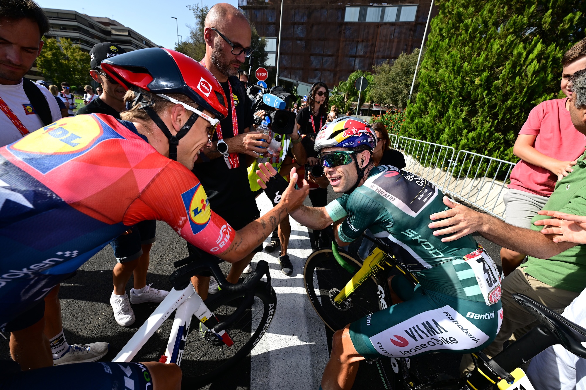 Thibau Nys of Lidl - Trek congratulates Belgian compatriot and stage winner Wout van Aert of Visma | Lease a Bike
