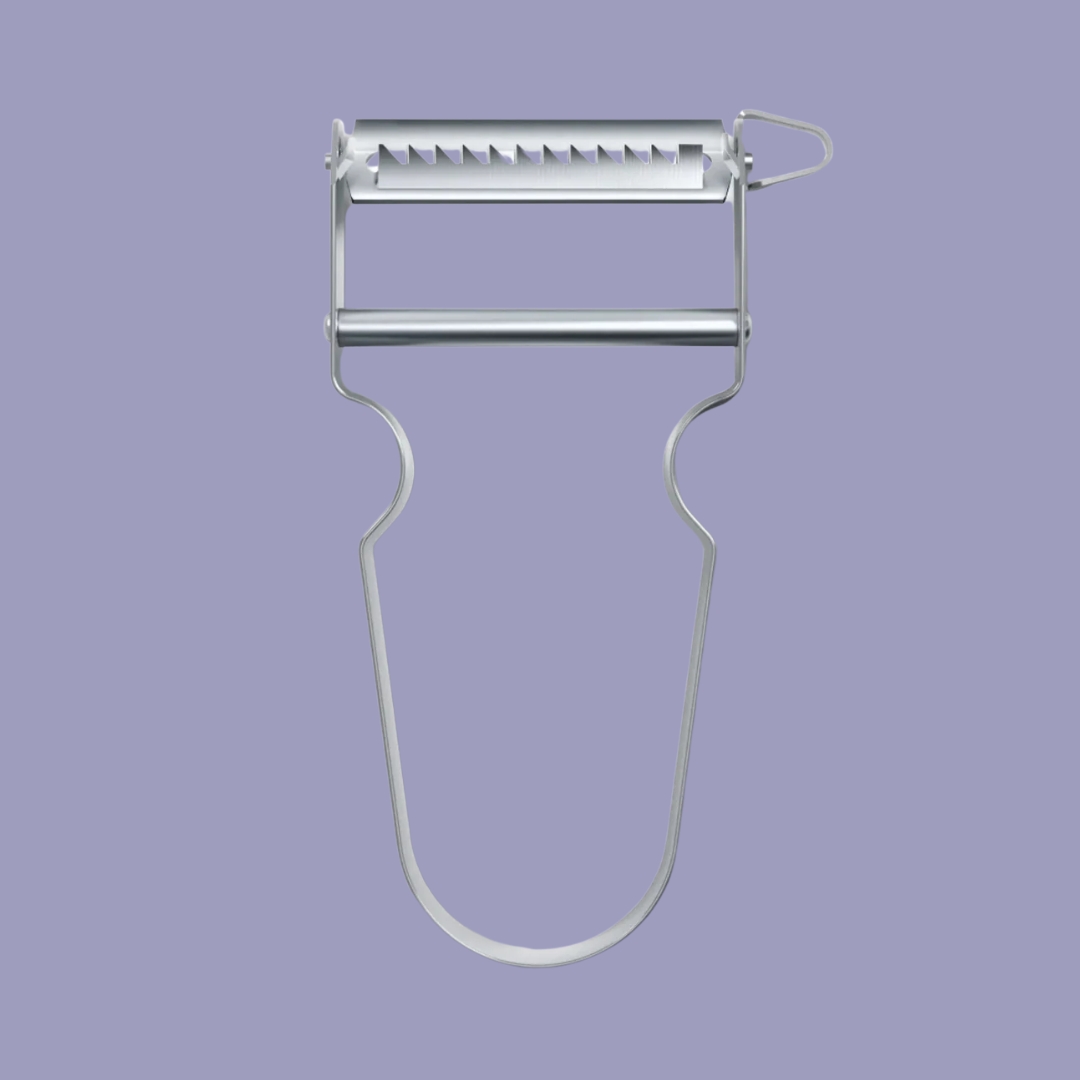 Victorinox Star Julienne Peeler in stainless steel against purple background.