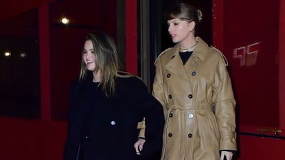 Taylor Swift in her birthday dinner outfit of a leather trench coat with Selena Gomez in a black coat