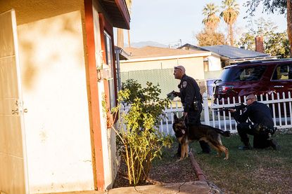San Bernardino police search a house related to the murder of 14 people