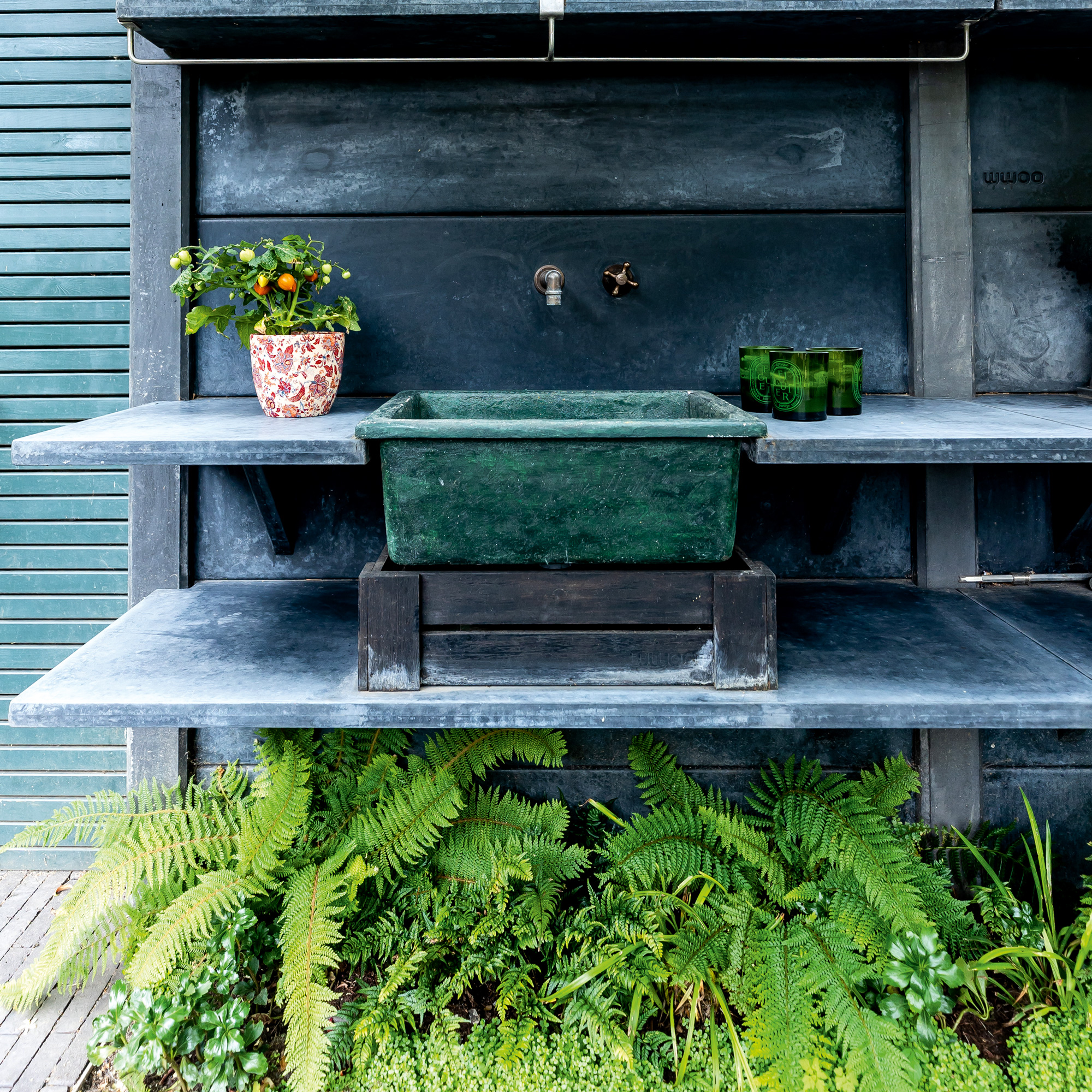 garden makeover with an outdoor kitchen with a kitchen sink