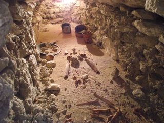 Inside the tomb, the researchers found 1,300-year-old bones and some ceramic vessels and plates. One of the vessels, visible in this photo, bore a date, 711 AD, and another, the inscription: '[This is] the drinking vessel of the young man/prince'.