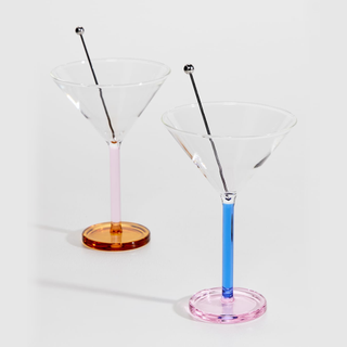A pair of martini glasses in pink and blue, and orange and pink