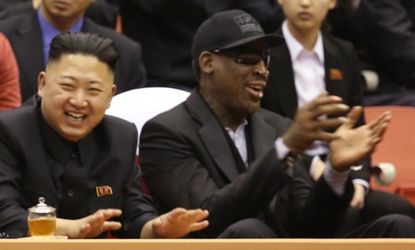 Kim Jong Un and former NBA star Dennis Rodman watch a basketball game together at an arena in Pyongyang, North Korea, Feb. 28.