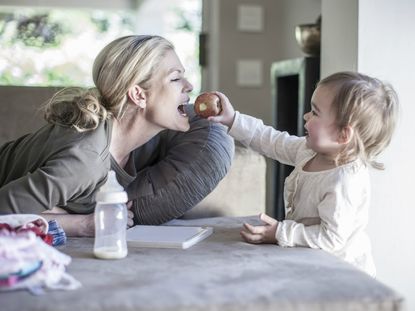 Daughter Feeding Mother