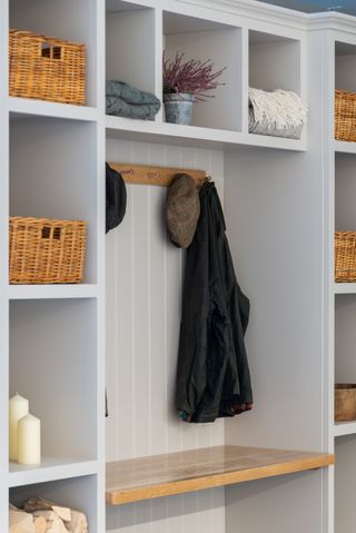 hallway storage/mudroom storage with built in units, bench area