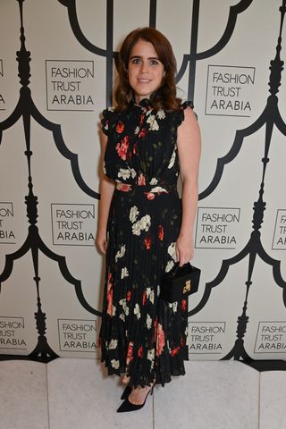 Princess Eugenie of York wearing a black floral maxi dress and black pumps at the FTA dinner in celebration in London June 2024