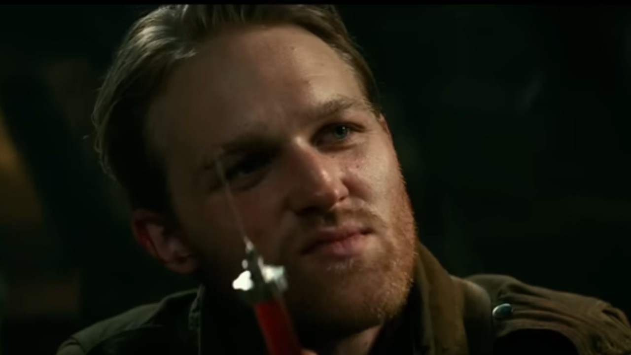 Wyatt Russell holding a needle in Overlord