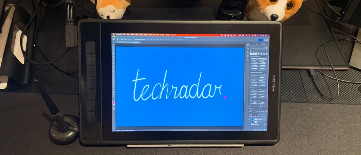 Huion Kamvas Pro 13 (2.5k) on a desk with the word TechRadar written