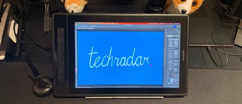 Huion Kamvas Pro 13 (2.5k) on a desk with the word TechRadar written