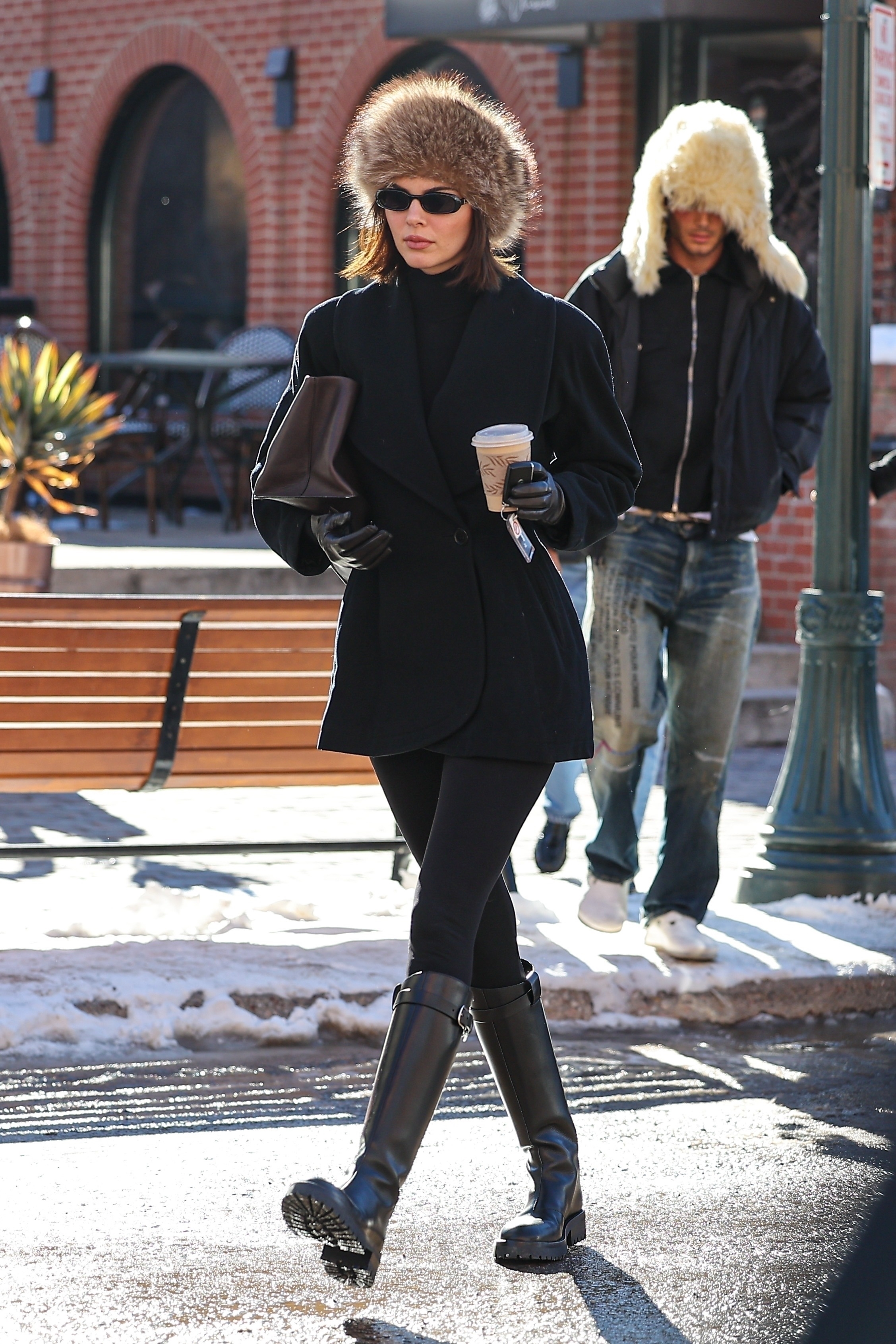 kendall jenner wearing all-black outfit and black boots