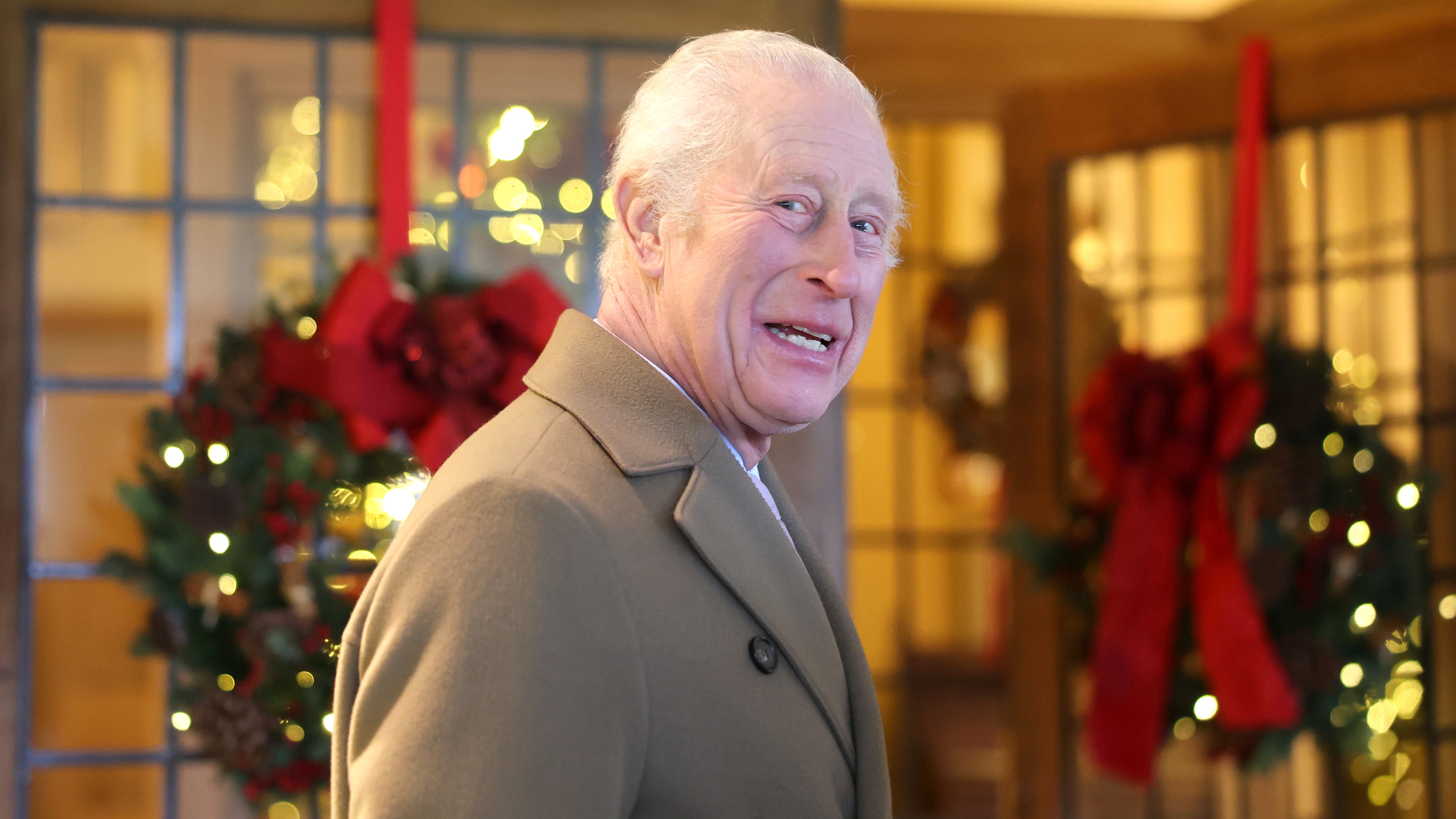 King Charles III smiles during the The King's Foundation's annual 'Crafts at Christmas' at Highgrove Gardens on December 13, 2024