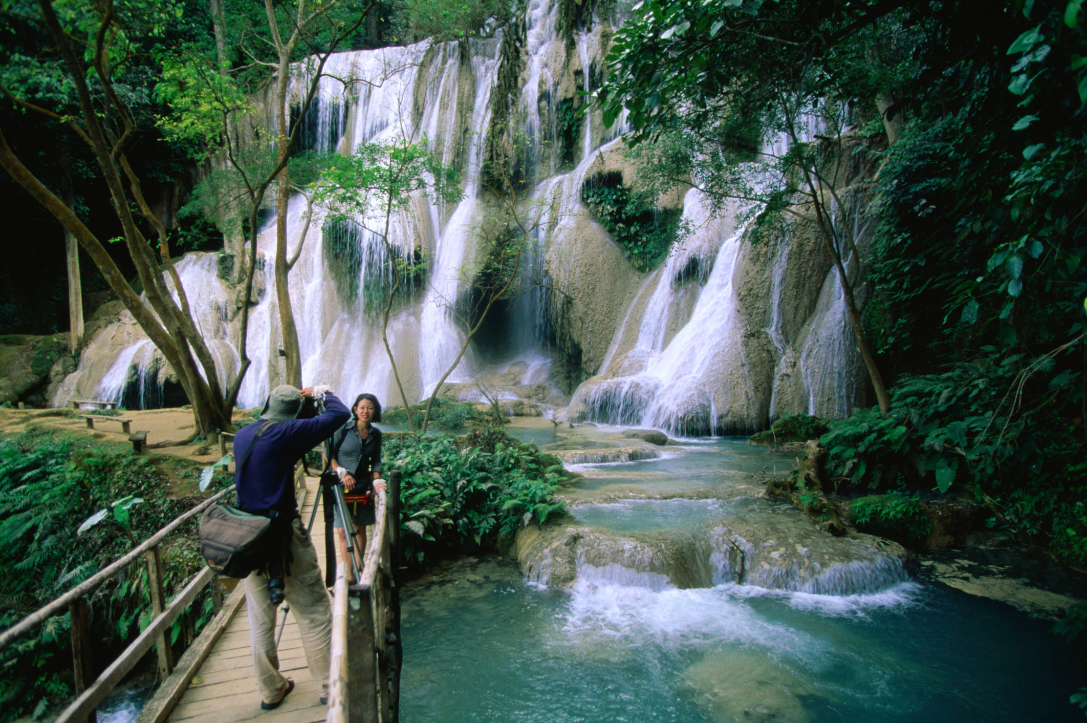 Tourists taking photos at Khuang Si Falls National Park