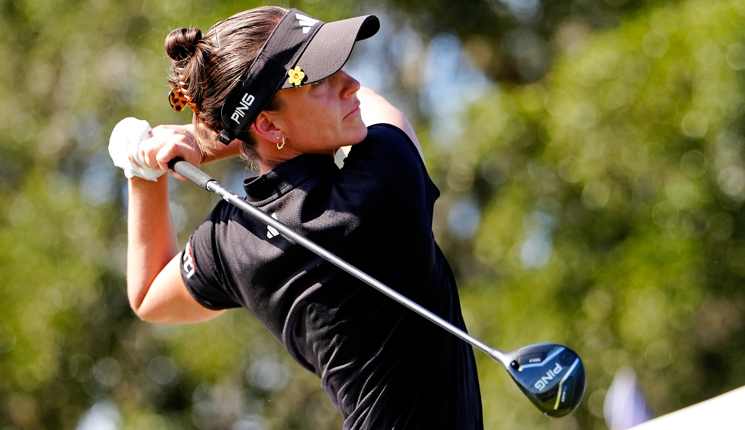 Linn Grant hits a fairway wood