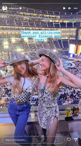 Brie Larson in a sheer lace dress and mirror cowboy hat with her friend at Beyoncé's concert.
