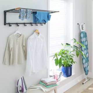 Wall mounted clothes airer drying clothes