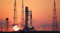 The Artemis II rocket on a launch pad at the Kennedy Space Center in Florida at sunrise.