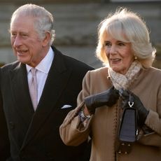 King Charles III and Camilla, Queen Consort leave Bolton Town Hall during a tour of Greater Manchester on January 20, 2023 in Bolton, United Kingdom.