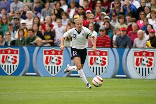 Kristine Lilly #13 of the United States moves the ball through midfield against Ukraine during an international friendly match on July 10, 2005 at Merlo Field in Portland, Oregon. The United States defeated Ukraine 7-0. (Photo by Jonathan Ferrey/Getty Images)