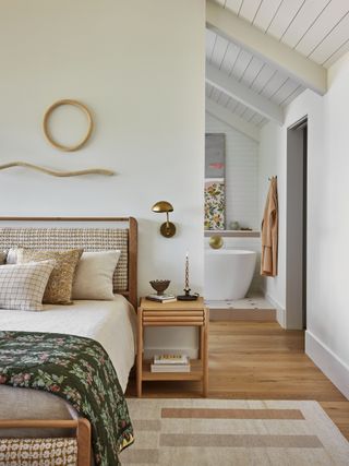 primary bedroom with open walkway through to the bathroom