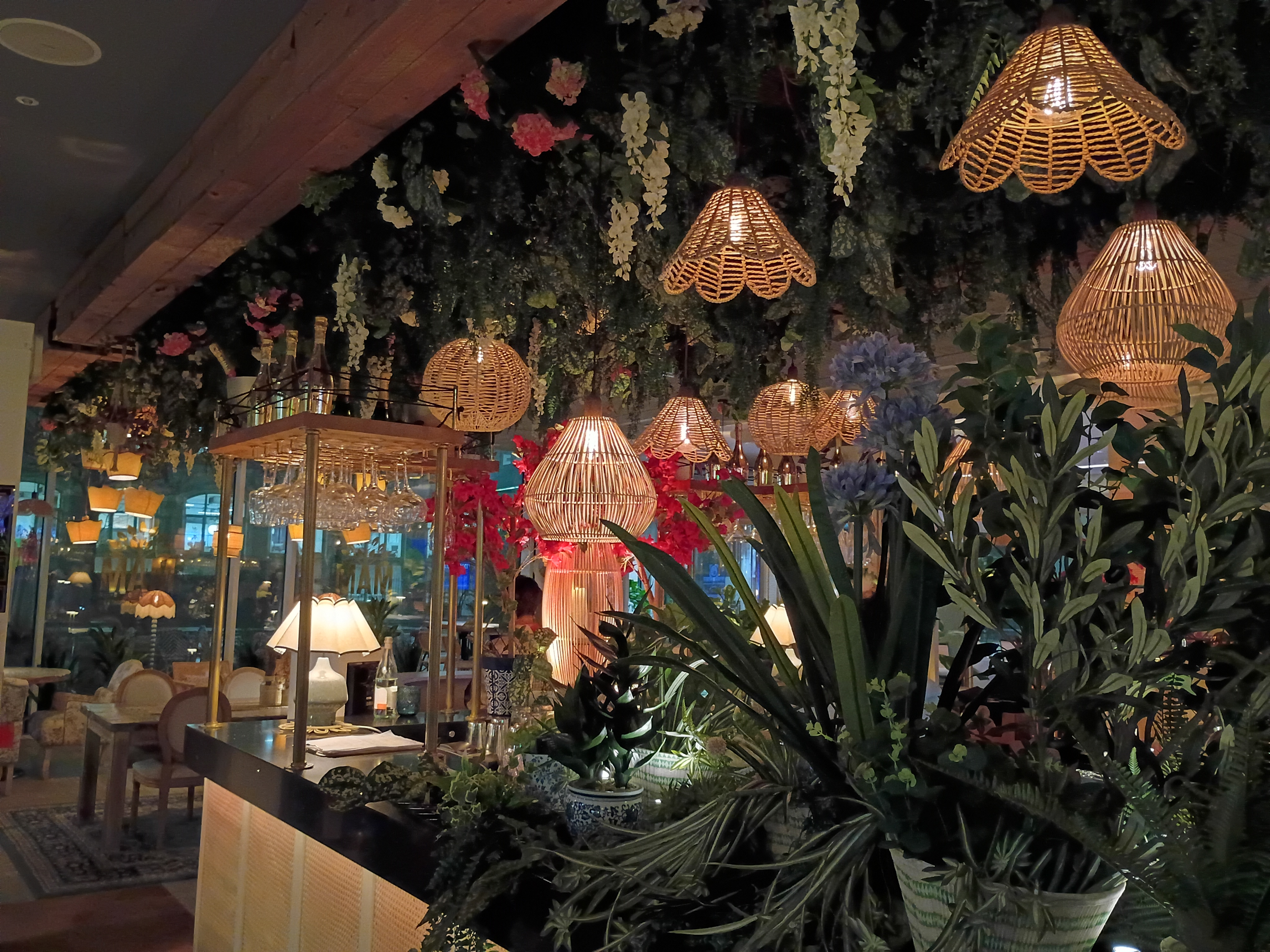 A restaurant with many plants