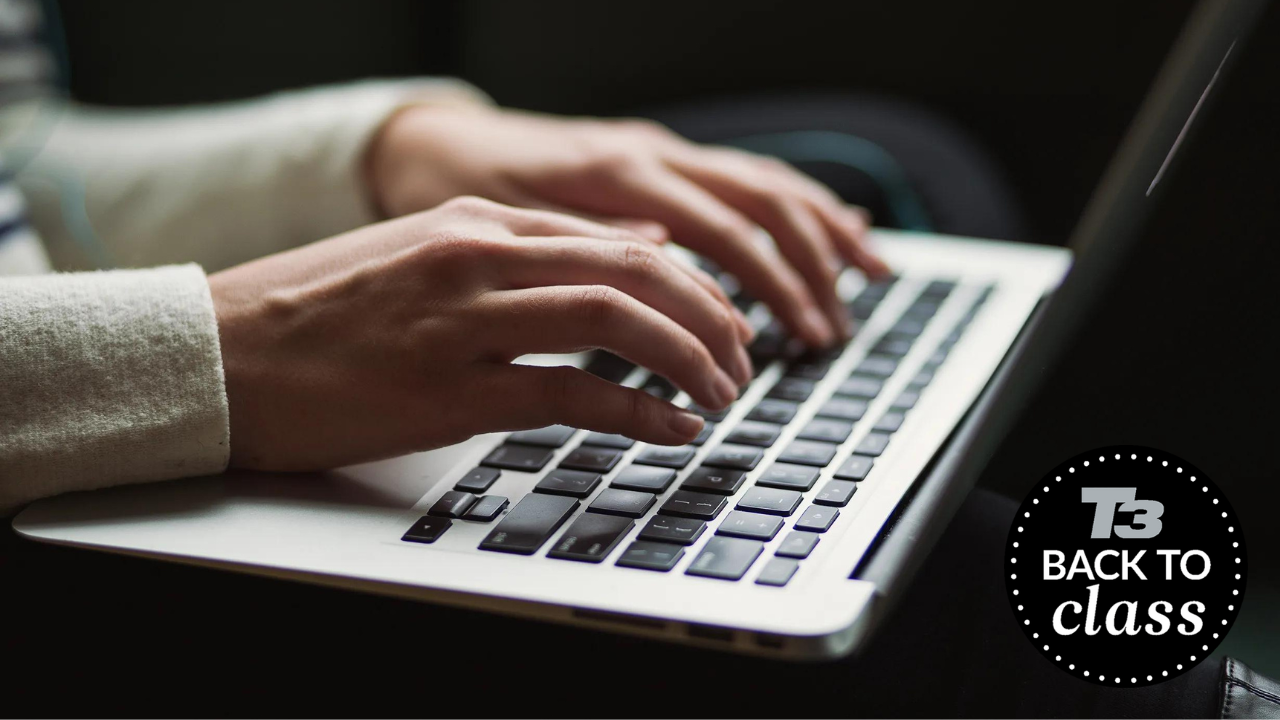 person typing on laptop