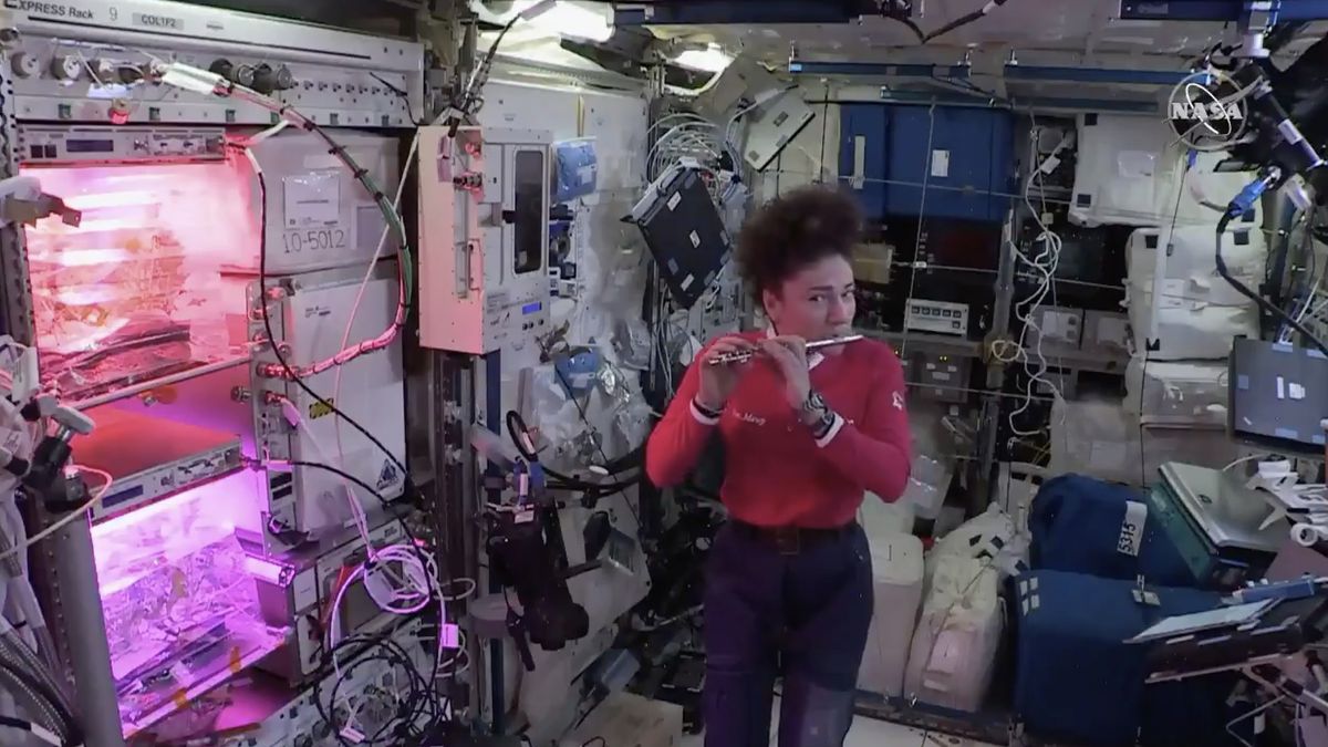 NASA astronaut Jessica Meir plays the piccolo at the International Space Station.
