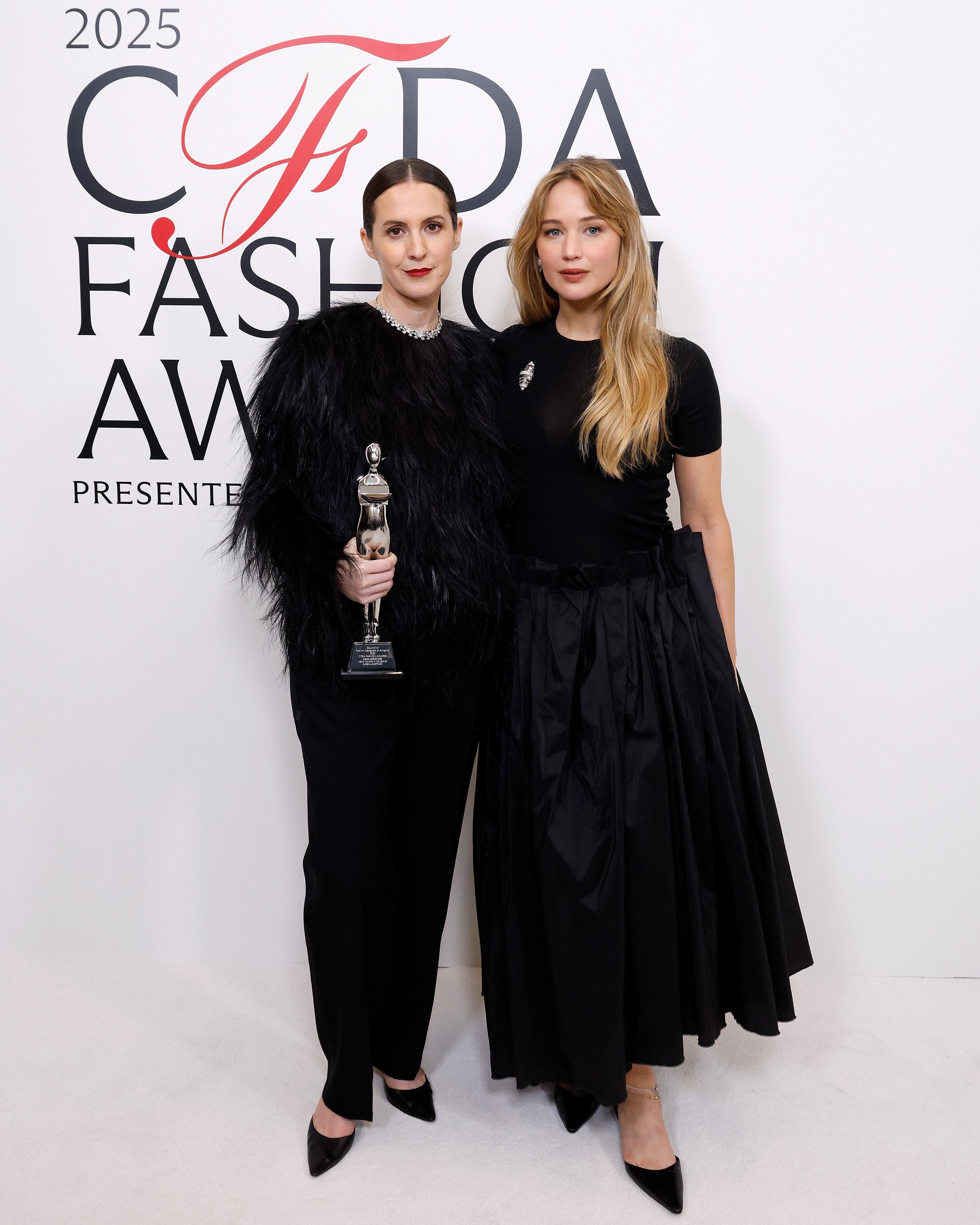 Jennifer Lawrence attended the CFDA awards wearing a black t-shirt dress and a silver brooch