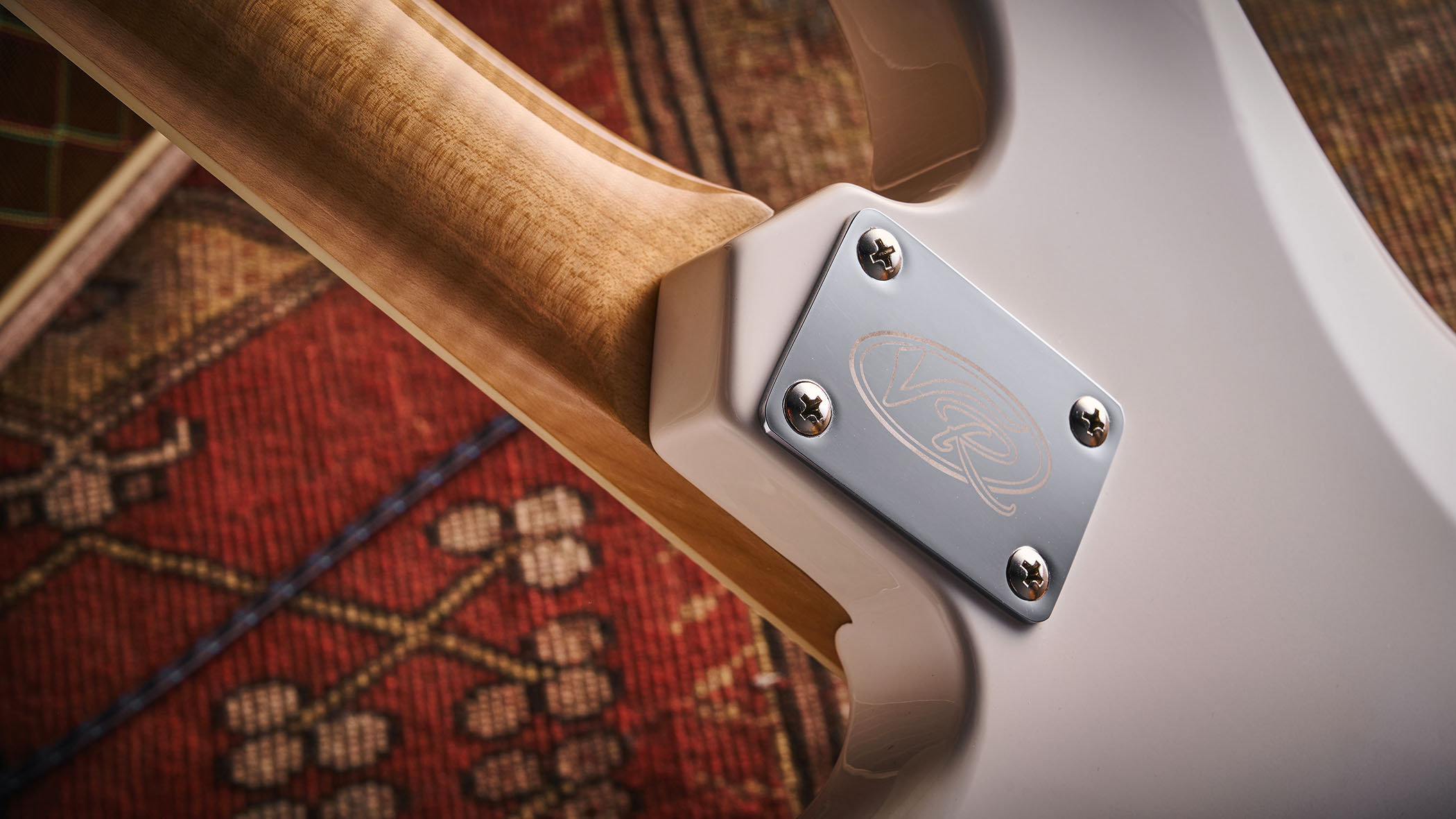 Vintage REVO Astrostar: the retro-inspired electric has three single-coils, a white finish with cream pickguard and is photographed in close-up.
