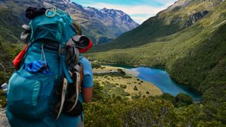 Hiker in mountainous landscape