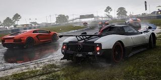 Cars speed across a rainy track in Forza 7