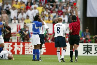 Ronaldinho holds his head after his red card in Brazil's World Cup quarter-final against England in 2002.