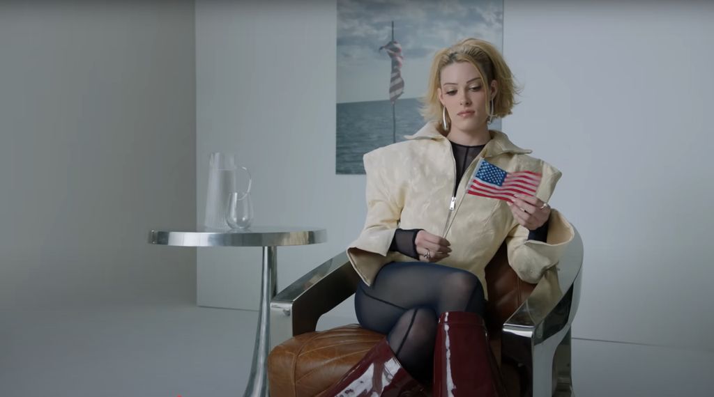 Lady on a chair with the flag