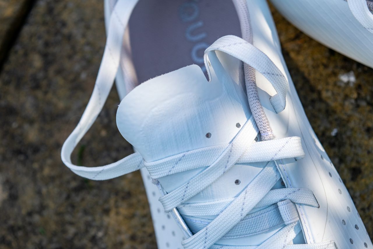 A pair of white Quoc M Pro Lace shoes