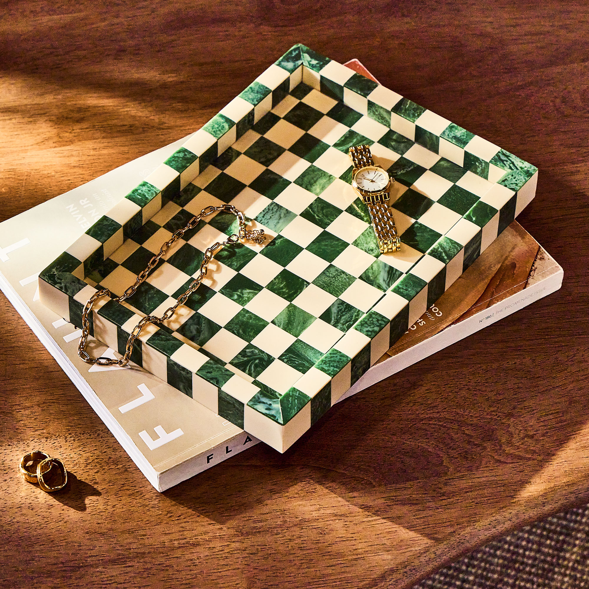 Green and white check tray on top of a magazine