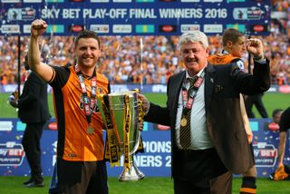 Alex Bruce and Steve Bruce celebration Hull City's play-off win and promotion in 2016.